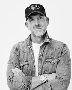 Justin Chenetski in a denim shirt